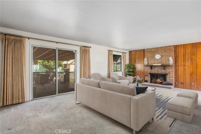 3071 Belle St, San Bernardino, CA 92404 - carpeted living area featuring a fireplace and wood walls