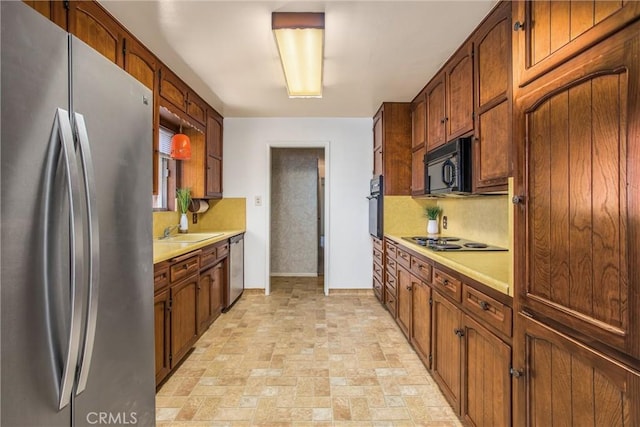 3071 Belle St, San Bernardino, CA 92404 - kitchen featuring black appliances, light countertops, and tasteful backsplash