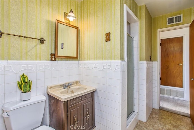 3071 Belle St, San Bernardino, CA 92404 - full bathroom featuring wallpapered walls, a wainscoted wall, vanity, a stall shower, and toilet