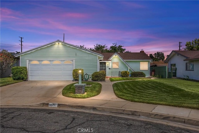 3071 Belle St, San Bernardino, CA 92404 - ranch-style home with driveway, a lawn, and an attached garage