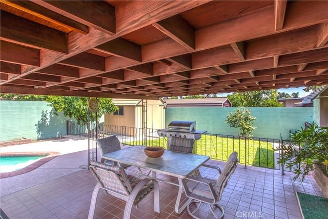 3071 Belle St, San Bernardino, CA 92404 - fenced backyard featuring area for grilling, outdoor dining area, and a patio