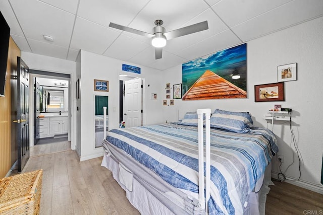 1845 Bayview Heights Dr Unit 110, San Diego, CA 92105 - bedroom featuring light wood-type flooring, ceiling fan, and connected bathroom