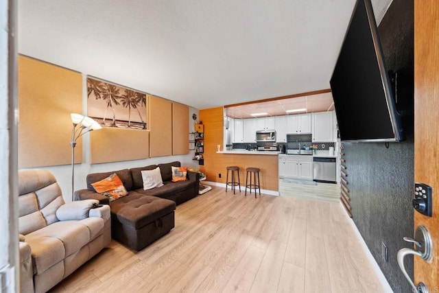 1845 Bayview Heights Dr Unit 110, San Diego, CA 92105 - living room featuring light wood-type flooring
