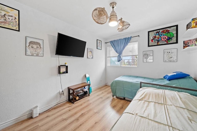 1845 Bayview Heights Dr Unit 110, San Diego, CA 92105 - bedroom featuring wood finished floors and baseboards