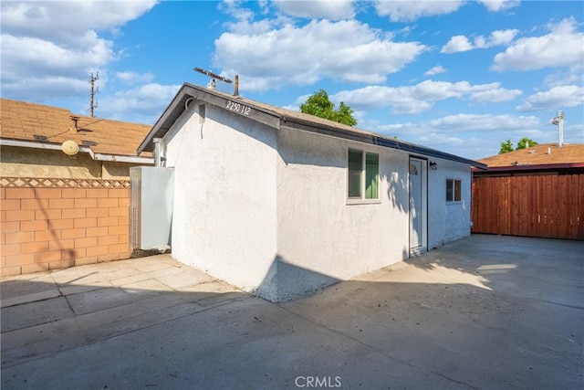 2250 Dorris Pl, Los Angeles, CA 90031 - rear view of property with stucco siding and a patio