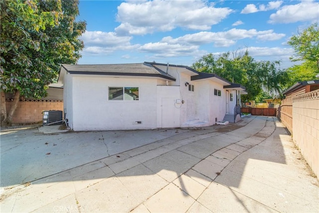 2250 Dorris Pl, Los Angeles, CA 90031 - rear view of house featuring a patio, central AC, stucco siding, and crawl space