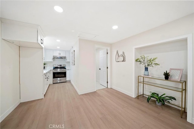 2250 Dorris Pl, Los Angeles, CA 90031 - kitchen featuring gas range, under cabinet range hood, light wood-type flooring, white cabinetry, and recessed lighting
