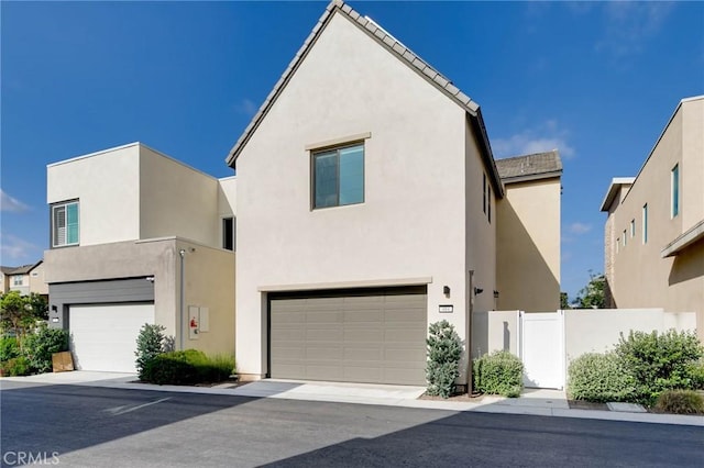484 Chorus, Irvine, CA 92618 - view of front facade featuring an attached garage and stucco siding