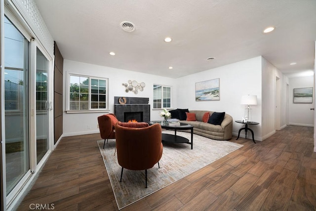 8151 Orangewood Ave, Stanton, CA 90680 - living area with dark wood-type flooring, a fireplace, recessed lighting, and baseboards