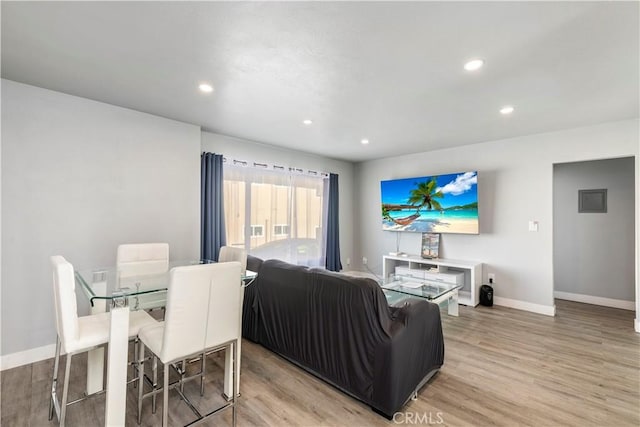 134 Palm Ave, National City, CA 91950 - living area with light wood finished floors, baseboards, and recessed lighting