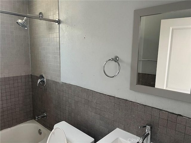 134 Palm Ave, National City, CA 91950 - bathroom featuring toilet, shower / washtub combination, and a sink
