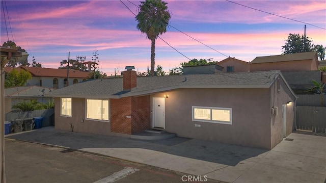 134 Palm Ave, National City, CA 91950 - ranch-style house with a chimney, stucco siding, and a patio