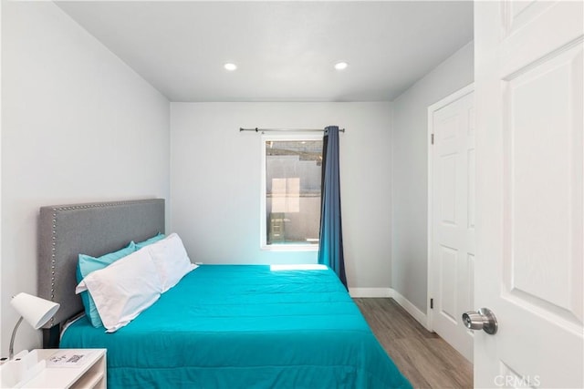 134 Palm Ave, National City, CA 91950 - bedroom with wood finished floors, recessed lighting, and baseboards