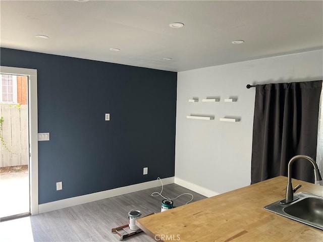 134 Palm Ave, National City, CA 91950 - home office featuring a sink, wood finished floors, baseboards, and recessed lighting