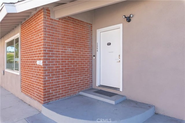 134 Palm Ave, National City, CA 91950 - doorway to property with stucco siding and brick siding