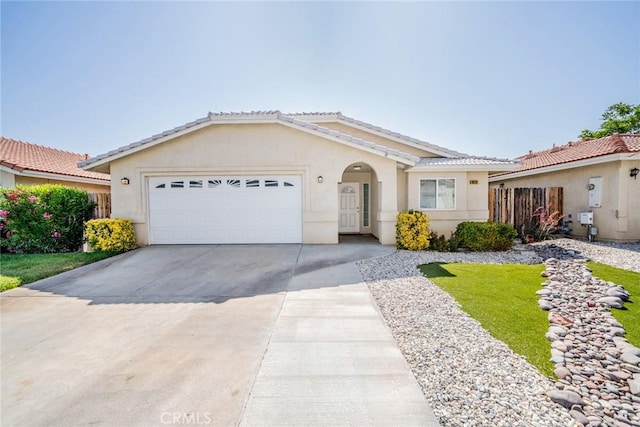 9591 Sagebrush Ct, Phelan, CA 92371 - single story home with an attached garage, driveway, stucco siding, and a tile roof