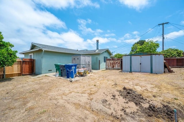 4038 Dartmouth Ln, Santa Maria, CA 93455 - back of house with a fenced backyard and stucco siding