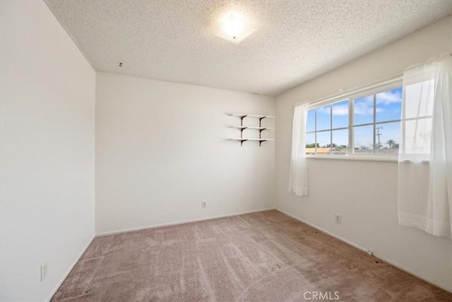4038 Dartmouth Ln, Santa Maria, CA 93455 - unfurnished room featuring carpet, a textured ceiling, and baseboards