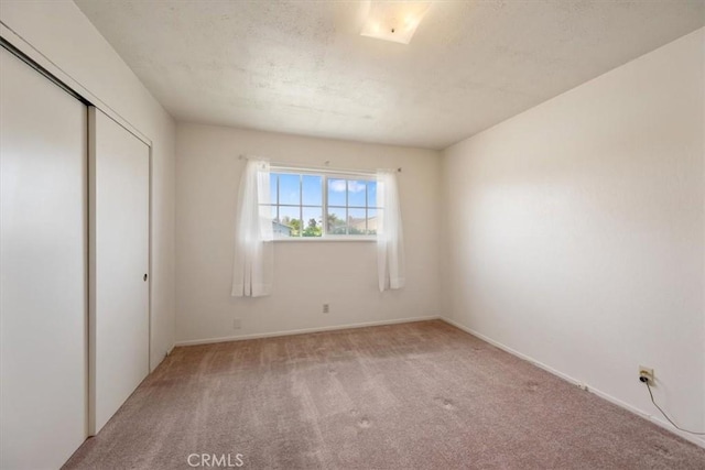 4038 Dartmouth Ln, Santa Maria, CA 93455 - unfurnished bedroom with light carpet, a closet, and baseboards