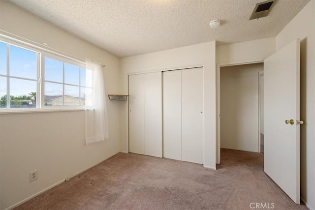 4038 Dartmouth Ln, Santa Maria, CA 93455 - unfurnished bedroom with carpet, a textured ceiling, and a closet