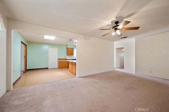 4038 Dartmouth Ln, Santa Maria, CA 93455 - unfurnished living room with light carpet and a ceiling fan