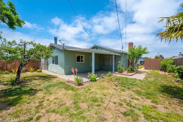 4038 Dartmouth Ln, Santa Maria, CA 93455 - back of house featuring stucco siding, a patio area, and a chimney