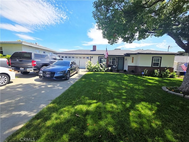 34939 Date Ave, Yucaipa, CA 92399 - ranch-style home with driveway, a garage, a chimney, a front yard, and brick siding