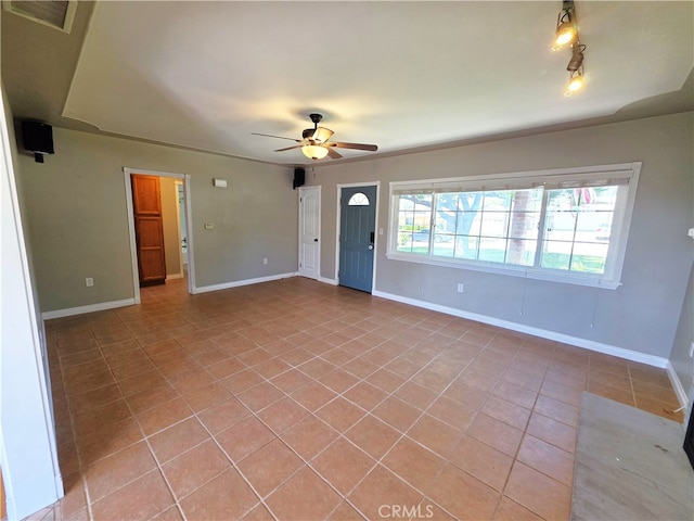 34939 Date Ave, Yucaipa, CA 92399 - unfurnished living room with light tile patterned floors and a ceiling fan