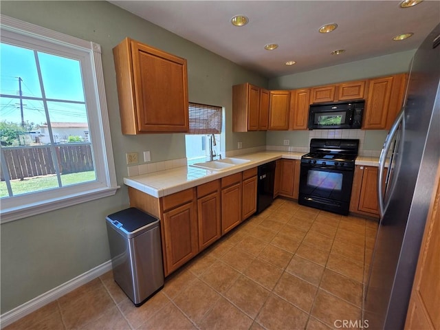 34939 Date Ave, Yucaipa, CA 92399 - kitchen featuring black appliances, healthy amount of natural light, light tile patterned flooring, and recessed lighting