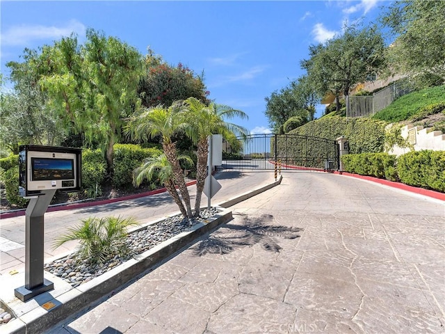 5637 Como Cir, Woodland Hills, CA 91367 - view of street with a gate, a gated entry, and curbs