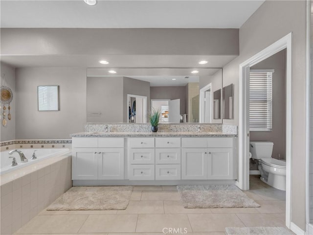5637 Como Cir, Woodland Hills, CA 91367 - full bath featuring double vanity, a garden tub, tile patterned floors, and recessed lighting