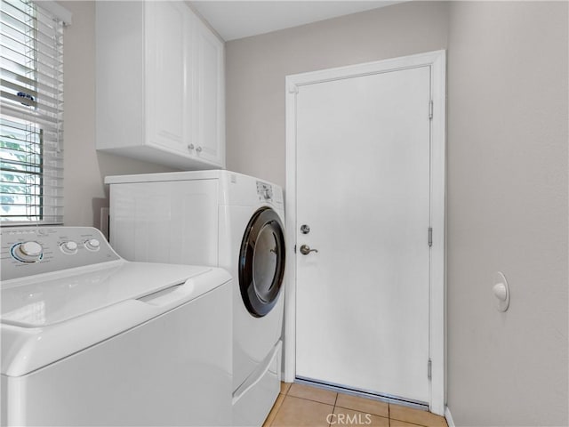 5637 Como Cir, Woodland Hills, CA 91367 - laundry room featuring cabinet space, washing machine and dryer, plenty of natural light, and light tile patterned floors