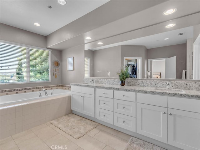 5637 Como Cir, Woodland Hills, CA 91367 - bathroom featuring double vanity, a garden tub, tile patterned flooring, and recessed lighting