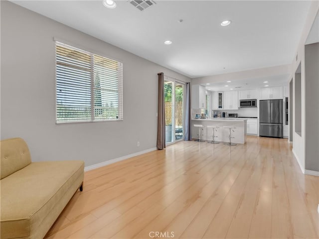 5637 Como Cir, Woodland Hills, CA 91367 - living area with light wood-style floors and recessed lighting