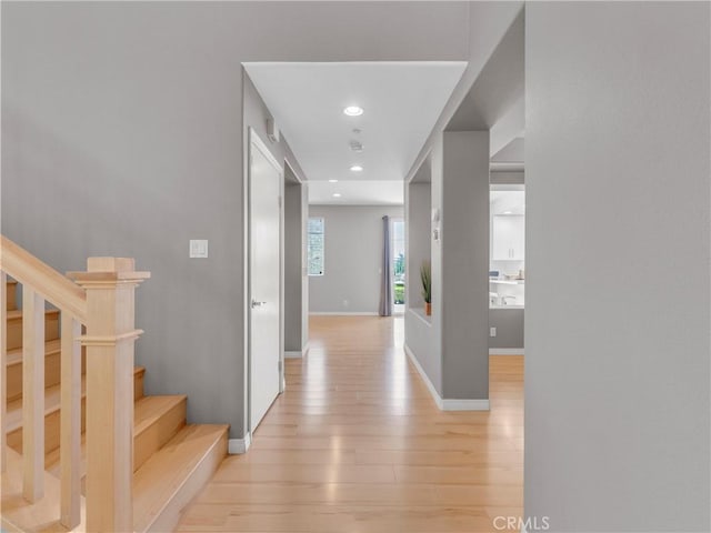 5637 Como Cir, Woodland Hills, CA 91367 - corridor with light wood-type flooring, stairs, and recessed lighting