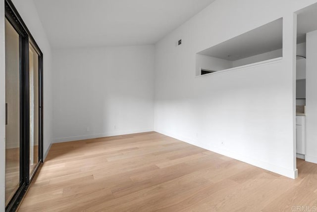 1680 N Coast Highway 101 Unit 36, Encinitas, CA 92024 - unfurnished bedroom with light wood-style flooring and baseboards