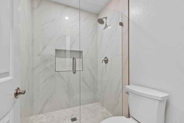 1680 N Coast Highway 101 Unit 36, Encinitas, CA 92024 - full bathroom featuring a marble finish shower and toilet