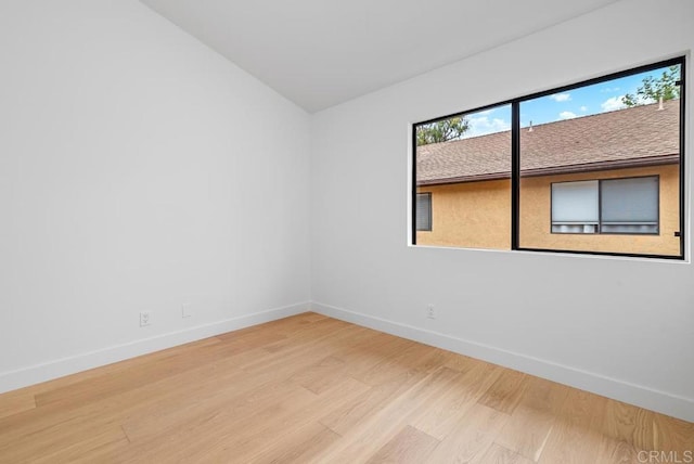 1680 N Coast Highway 101 Unit 36, Encinitas, CA 92024 - empty room with light wood-style flooring and lofted ceiling