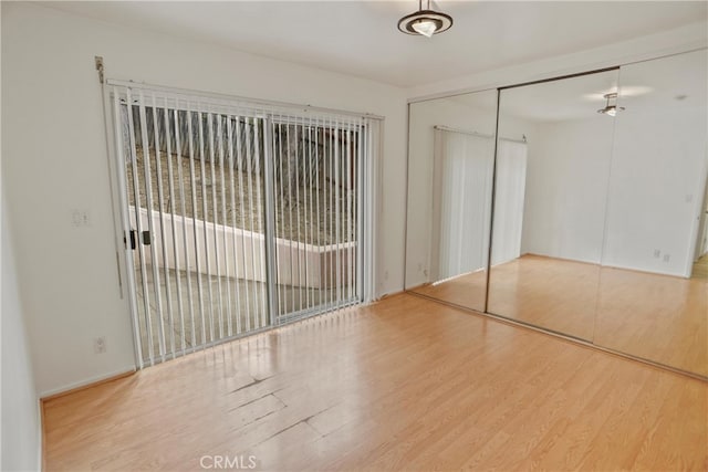 4182 Sunswept Dr, Studio City, CA 91604 - unfurnished bedroom featuring wood finished floors and a closet