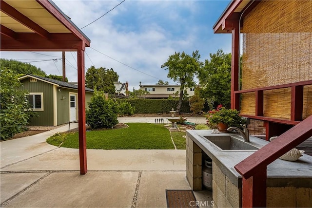 2902 E Trenton E, Orange, CA 92867 - view of patio / terrace featuring a sink and an outdoor structure