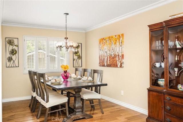 2902 E Trenton E, Orange, CA 92867 - dining area with a chandelier, light wood-type flooring, and ornamental molding