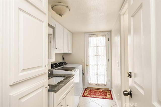 2902 E Trenton E, Orange, CA 92867 - washroom with washing machine and clothes dryer, cabinet space, light tile patterned floors, and a textured ceiling