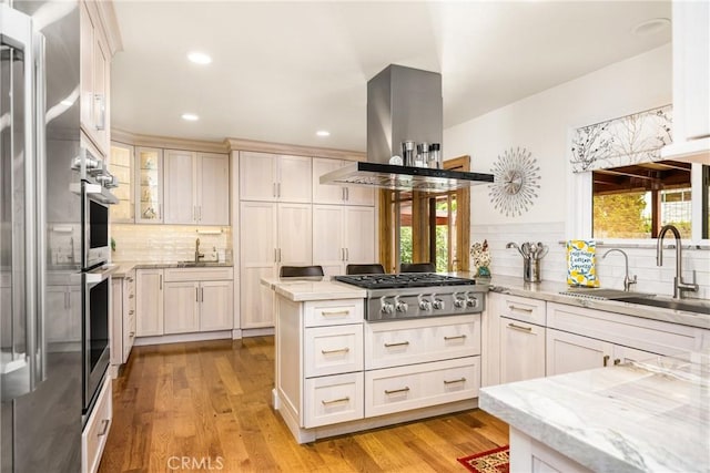 2902 E Trenton E, Orange, CA 92867 - kitchen with stainless steel gas stovetop, decorative backsplash, healthy amount of natural light, light stone countertops, and recessed lighting
