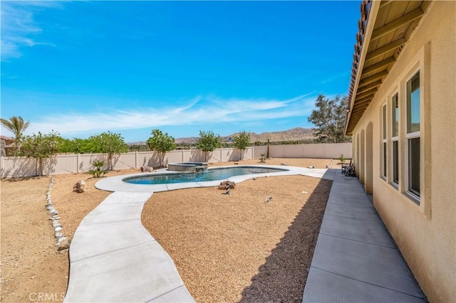 7988 Borrego Ct, Yucca Valley, CA 92284 - view of pool with a fenced backyard, a pool with connected hot tub, and a patio area