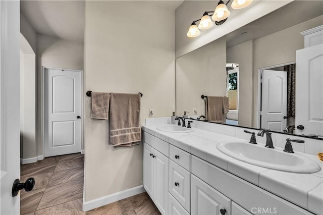 7988 Borrego Ct, Yucca Valley, CA 92284 - full bathroom featuring double vanity and baseboards
