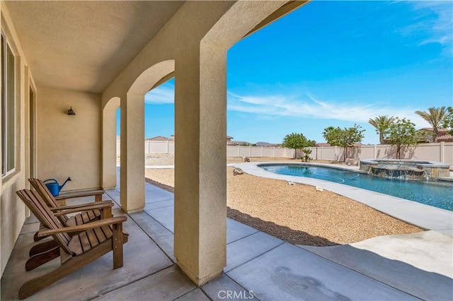 7988 Borrego Ct, Yucca Valley, CA 92284 - view of swimming pool featuring a fenced backyard, a patio area, and a pool with connected hot tub