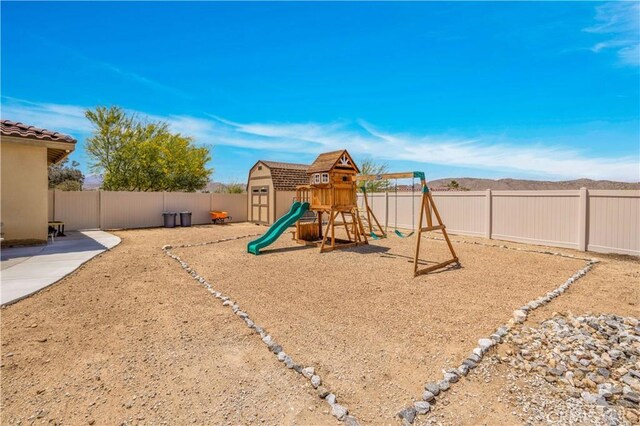 7988 Borrego Ct, Yucca Valley, CA 92284 - view of jungle gym featuring a fenced backyard
