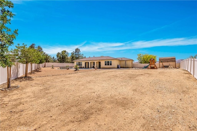 7988 Borrego Ct, Yucca Valley, CA 92284 - fenced backyard featuring a playground