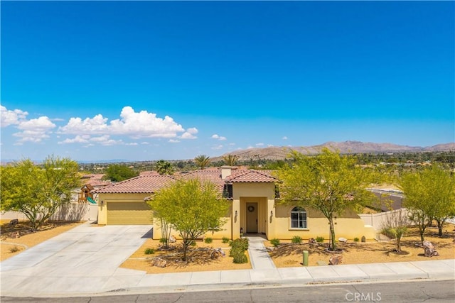 7988 Borrego Ct, Yucca Valley, CA 92284 - view of front of home with a tiled roof, stucco siding, driveway, and a garage