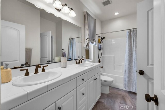 7988 Borrego Ct, Yucca Valley, CA 92284 - bathroom with double vanity, toilet, shower / bathtub combination with curtain, and recessed lighting